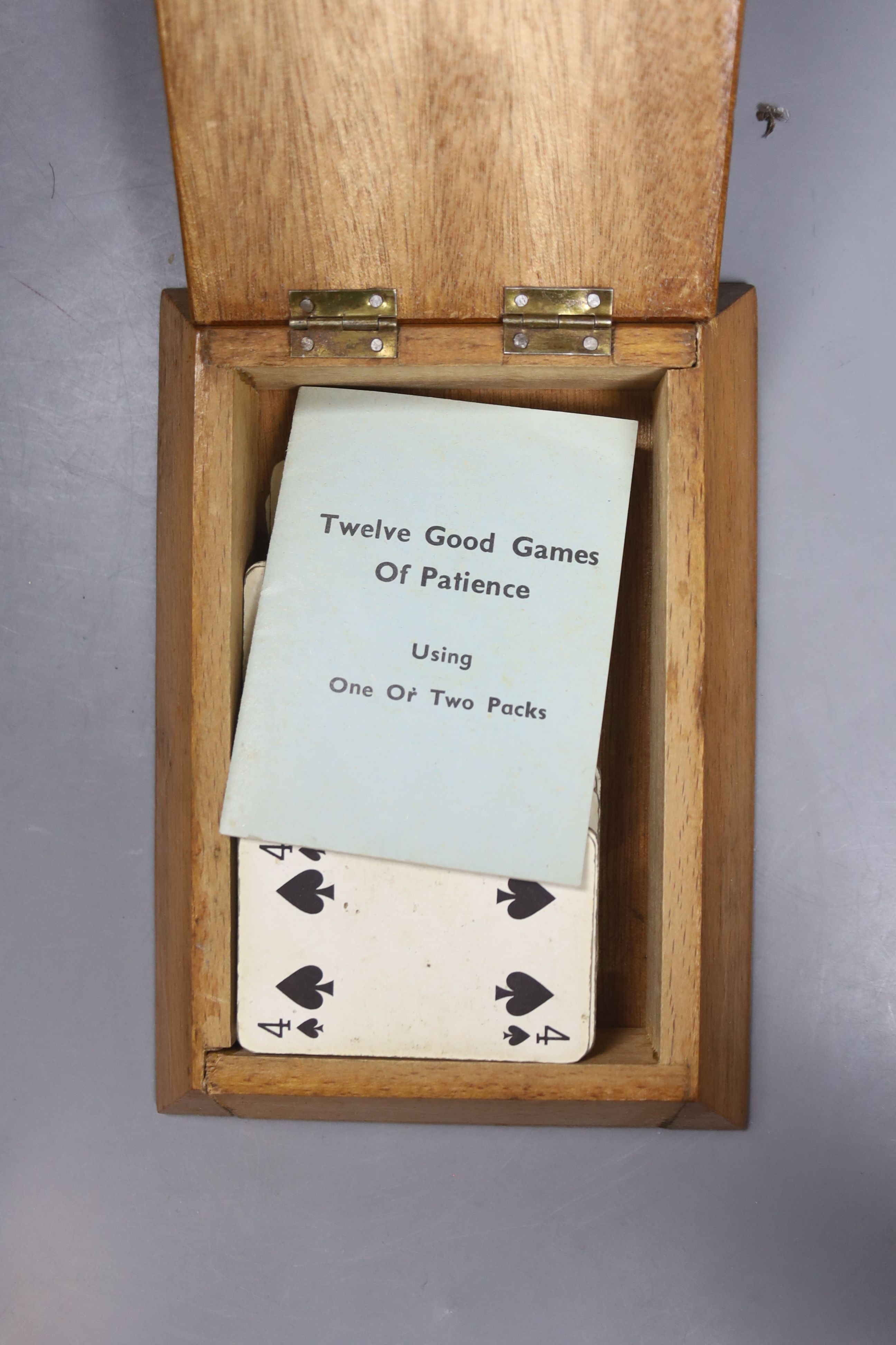 An olive wood blotter pad, 30cm two cased packs cards